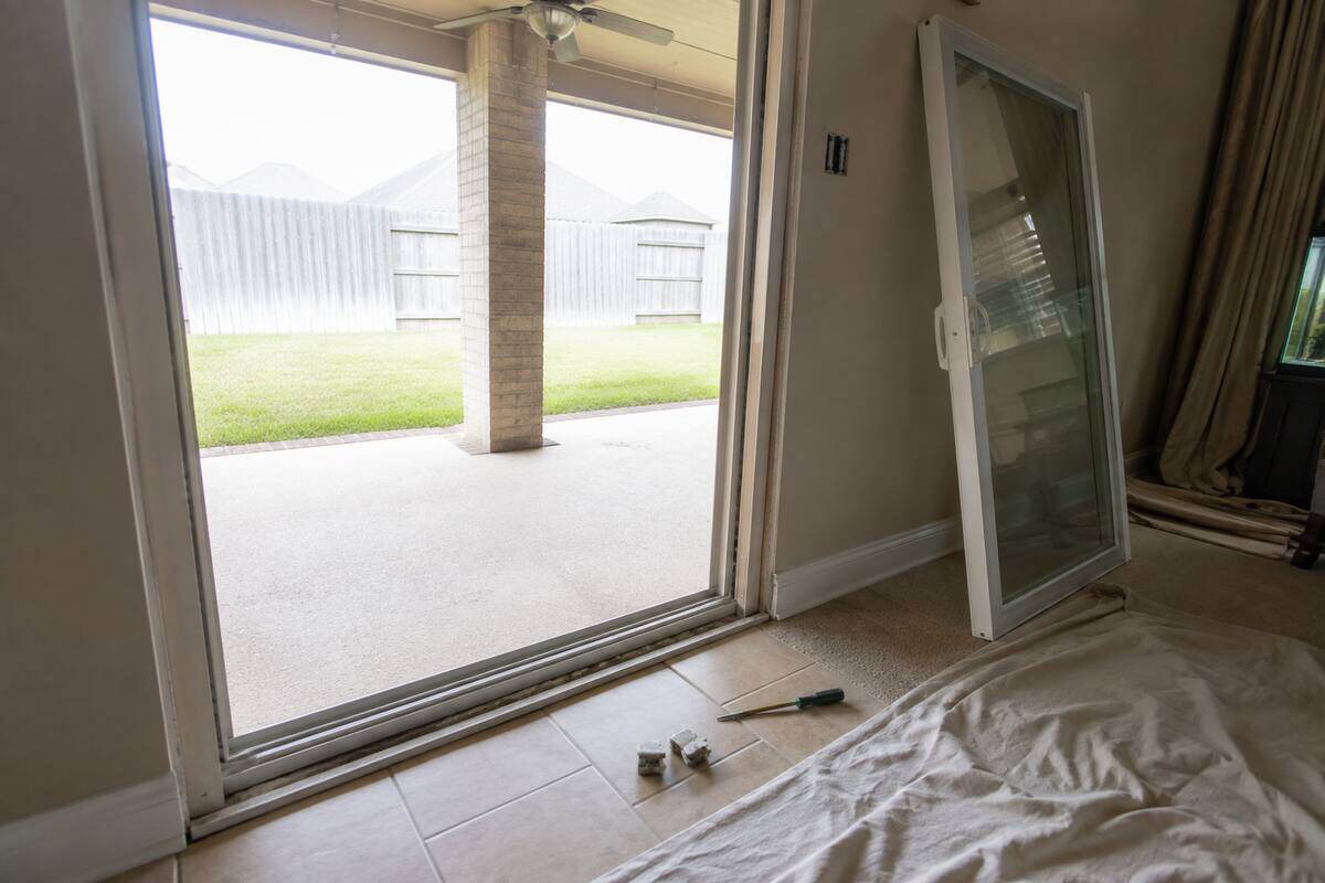 Sliding patio door panel removed to expose the track